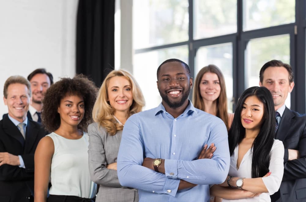 A diverse team standing confidently together.